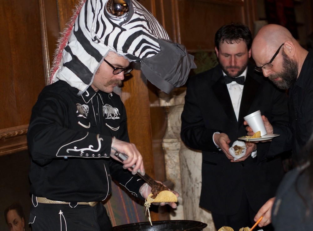 Jason Engdahl serving beaver tacos. Photo by Kirsten Stamn.